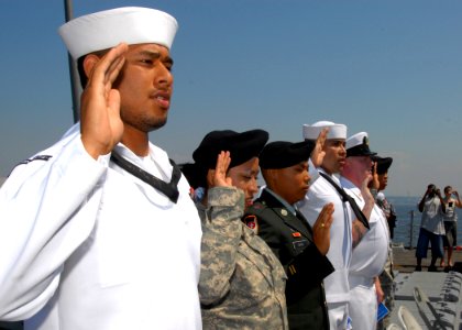 US Navy 090729-N-9860Y-002 Seventeen service members from thirteen countries take the oath of citizenship at a naturalization ceremony aboard the guided-missile destroyer USS Momsen (DDG 92)