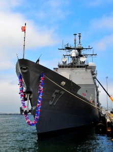 US Navy 090730-N-4774B-094 he guided-missile cruiser USS Lake Champlain (CG 57) is adorned with a lei during a homecoming celebration