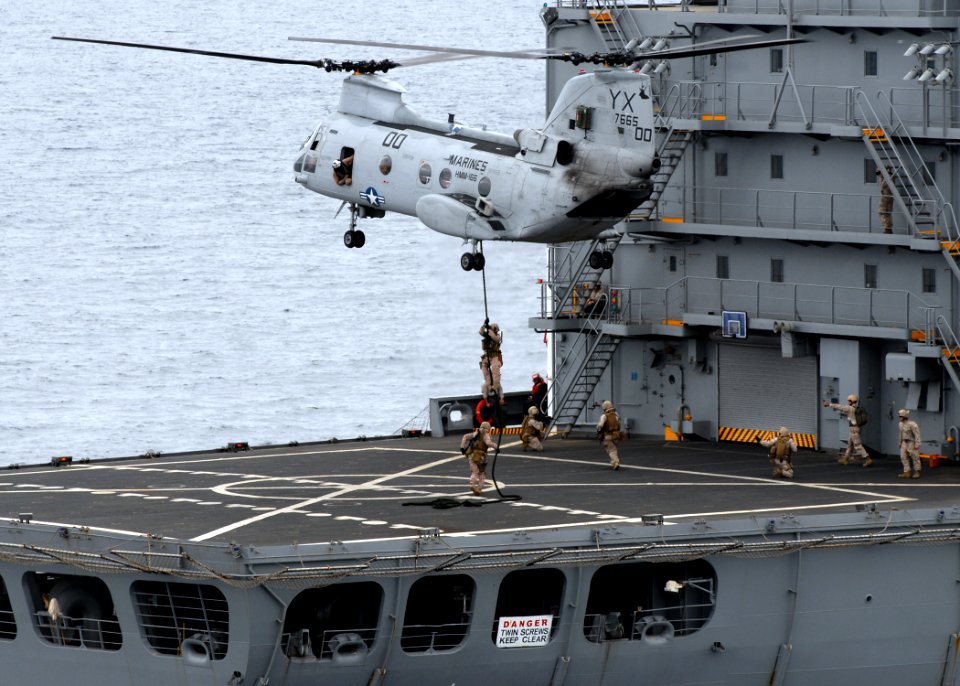 US Navy 090730-N-5148B-109 Marines assigned to the Ground Combat Element of the 11th Marine Expeditionary Unit (11th MEU), embarked aboard the amphibious dock landing ship USS Rushmore (LSD 47), fast rope out of an Ch-46E Sea K