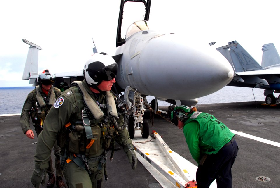 US Navy 090801-N-9760Z-018 Rear Adm. John W. Miller, commander of Carrier Strike Group Eleven (CVW) 11, performs a pre-flight inspection of an F-A-18F Super Hornet assigned to the Black Aces of Strike Fighter Squadron (VFA) 41