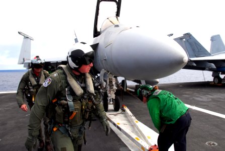 US Navy 090801-N-9760Z-018 Rear Adm. John W. Miller, commander of Carrier Strike Group Eleven (CVW) 11, performs a pre-flight inspection of an F-A-18F Super Hornet assigned to the Black Aces of Strike Fighter Squadron (VFA) 41