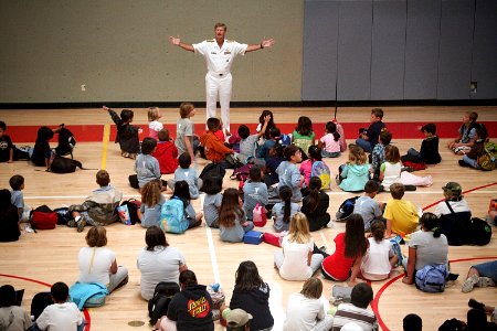 US Navy 090805-N-3038C-005 Rear Adm. Robert L. Thomas, director of Strategy and Policy Division (N51), speaks to children and answers questions about the Navy during a Salinas Navy Week event at the YMCA of Monterey County photo