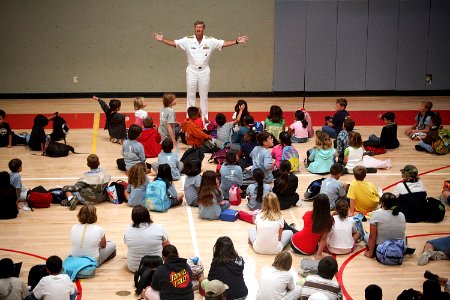US Navy 090805-N-3038C-005 Rear Adm. Robert L. Thomas, director of Strategy and Policy Division (N51), speaks to children and answers questions about the Navy during a Salinas Navy Week event at the YMCA of Monterey County