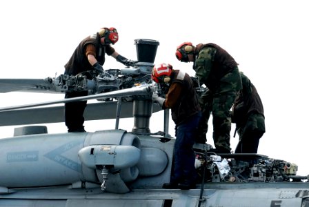 US Navy 090802-N-2918M-008 Sailors assigned to the Indians of Helicopter Anti-Submarine Squadron (HS) 6 perform maintenance on an HH-60H Sea Hawk helicopter aboard the aircraft carrier USS Nimitz (CVN 68)