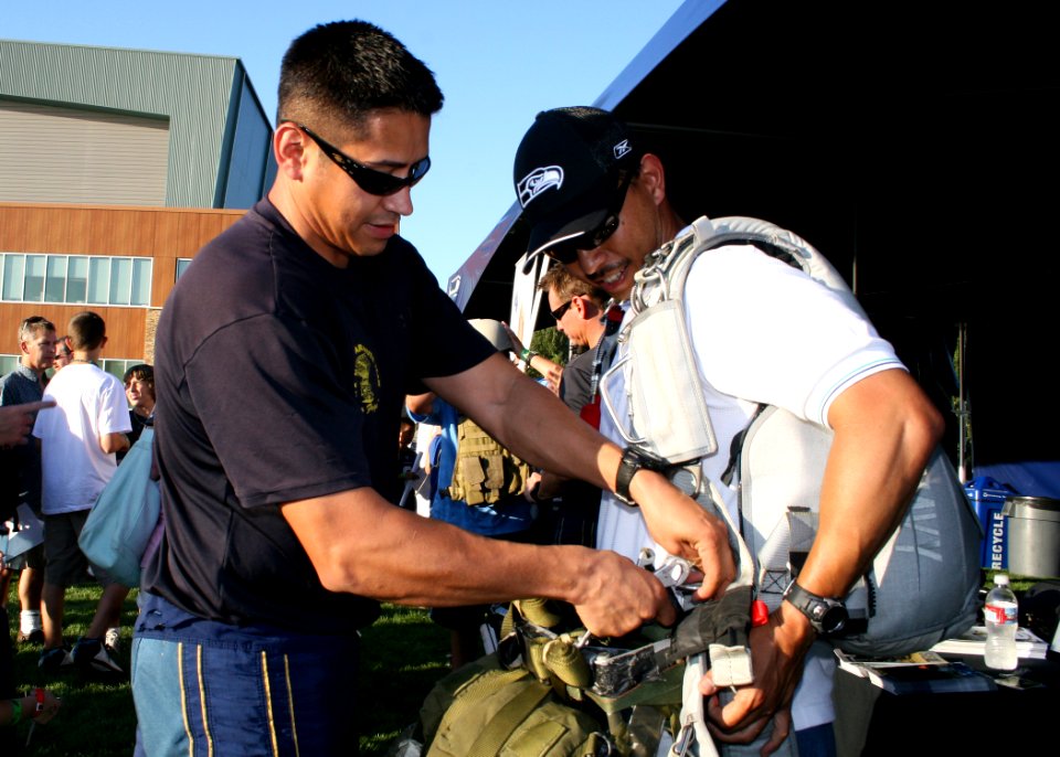 US Navy 090803-N-5366K-122 Aircrew Survival Equipmentman 1st Class Victor Maldonado, assigned to the U.S. Navy parachute team, the