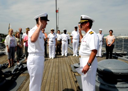 US Navy 090731-N-7478G-135 Master Chief Intelligence Specialist David Johnson, assigned to U.S. 7th Fleet staff, reenlists aboard the historic Japanese naval battleship Mikasa with Capt. James Fanell administering the oath