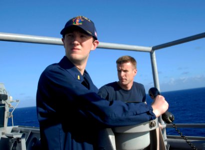 US Navy 090804-N-2452A-002 Ensign Christopher Ross, left, and Cmdr. Daniel Blackburn, commanding officer of the Harpers Ferry-class dock landing ship USS Oak Hill (LSD 51