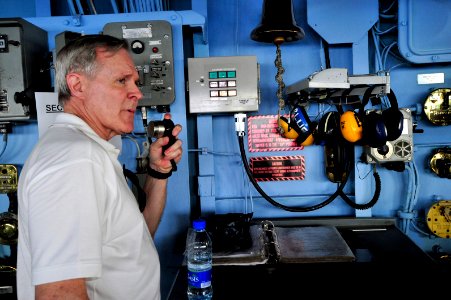US Navy 090803-N-0506A-296 Secretary of the Navy (SECNAV) the Honorable Ray Mabus makes an announcement to Sailors aboard the amphibious dock landing ship USS Fort McHenry (LSD 43)
