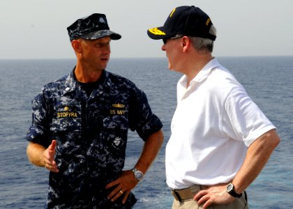 US Navy 090803-N-1831S-334 Secretary of the Navy (SECNAV) the Honorable Ray Mabus, talks with Cmdr. Chris Stopyra, commanding officer of the amphibious dock landing ship USS Fort McHenry (LSD 43), during a visit to the ship