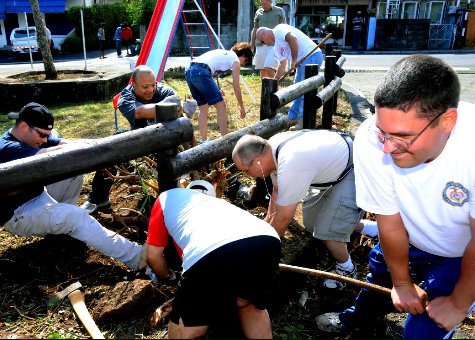 US Navy 090801-N-6138K-394 Sailors assigned to the guided-missile destroyer USS Arleigh Burke (DDG 51) work with personnel from the U.S. Embassy in Mauritius and the local community to refurbish a public park in Port Louie