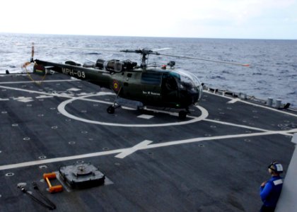 US Navy 090803-N-6138K-505 A Mauritius National Coast Guard Alouette-class III helicopter lands aboard the guided-missile destroyer USS Arleigh Burke (DDG 51) during flight operations training photo