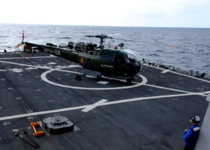 US Navy 090803-N-6138K-505 A Mauritius National Coast Guard Alouette-class III helicopter lands aboard the guided-missile destroyer USS Arleigh Burke (DDG 51) during flight operations training