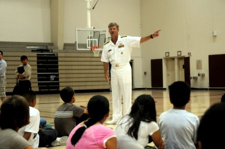 US Navy 090805-N-6220J-006 Rear Adm. Robert L. Thomas Jr., Director of Strategy and Policy Division (N51), speaks with children at the Boys ^ Girls Club of Monterey County during Salinas Navy Week photo