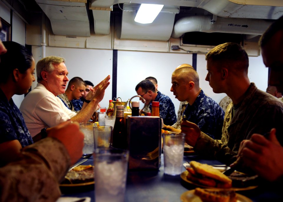 US Navy 090803-N-1831S-188 ecretary of the Navy (SECNAV) the Honorable Ray Mabus eats lunch with Sailors and embarked Marines from the 22nd Marine Expeditionary Unit (22nd MEU) during a visit to the amphibious dock landing ship