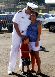US Navy 090807-N-0995C-003 Lt. Daniel Supple spends a moment with his family before departing aboard the Ticonderoga-class guided-missile cruiser USS Chosin (CG 65)