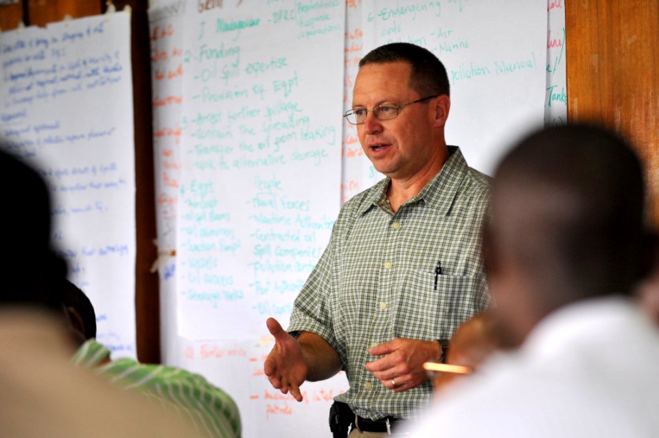 US Navy 090806-N-2420K-006 U.S. Navy Capt. Jeffery Landsman, a professor with the U.S. Naval War College, discusses an oil spill scenario with students at the Maritime Center of Excellence (MCE) course at Bandari College
