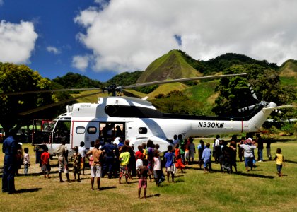 US Navy 090809-N-2638R-003 Children from the village of Visale take a tour of an SA-330 Puma Helicopter from the Military Sealift Command dry cargo and ammunition ship USNS Richard E. Byrd (T-AKE 4)