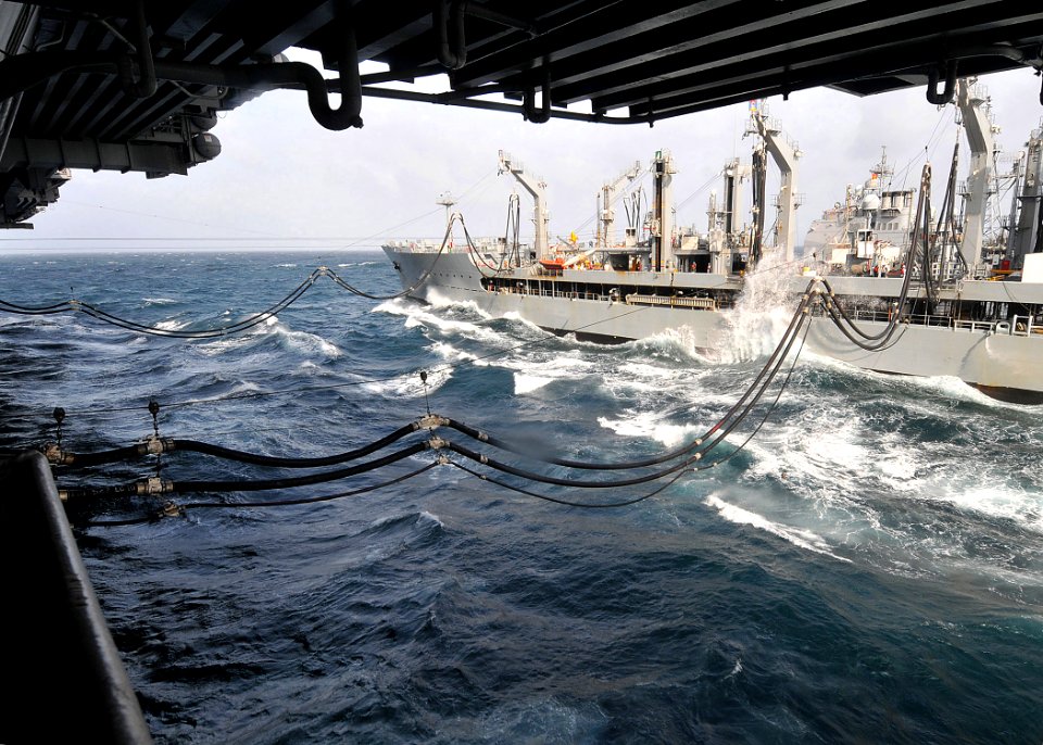 US Navy 090809-N-6233H-064 The aircraft carrier USS George Washington (CVN 73) receives fuel and stores from the Military Sealift Command fleet replenishment oiler USNS Pecos (T-AO 197)