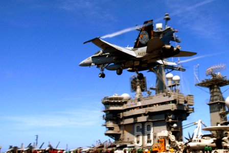 US Navy 090810-N-2600H-144 Capt. Bret Batchelder, commander, Carrier Air Wing (CVW) 11, makes a high-speed pass in an F-A-18C Hornet assigned the Warhawks of Strike Fighter Squadron (VFA) 97 over the flight deck of the aircraft