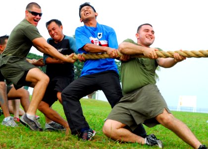 US Navy 090807-N-5207L-345 ance Cpl. Steve Martinez, right, leads fellow U.S. Marines and Sailors from the Royal Brunei Navy in a tug-of-war during a Cooperation Afloat Readiness and Training (CARAT) Brunei 2009 sports day