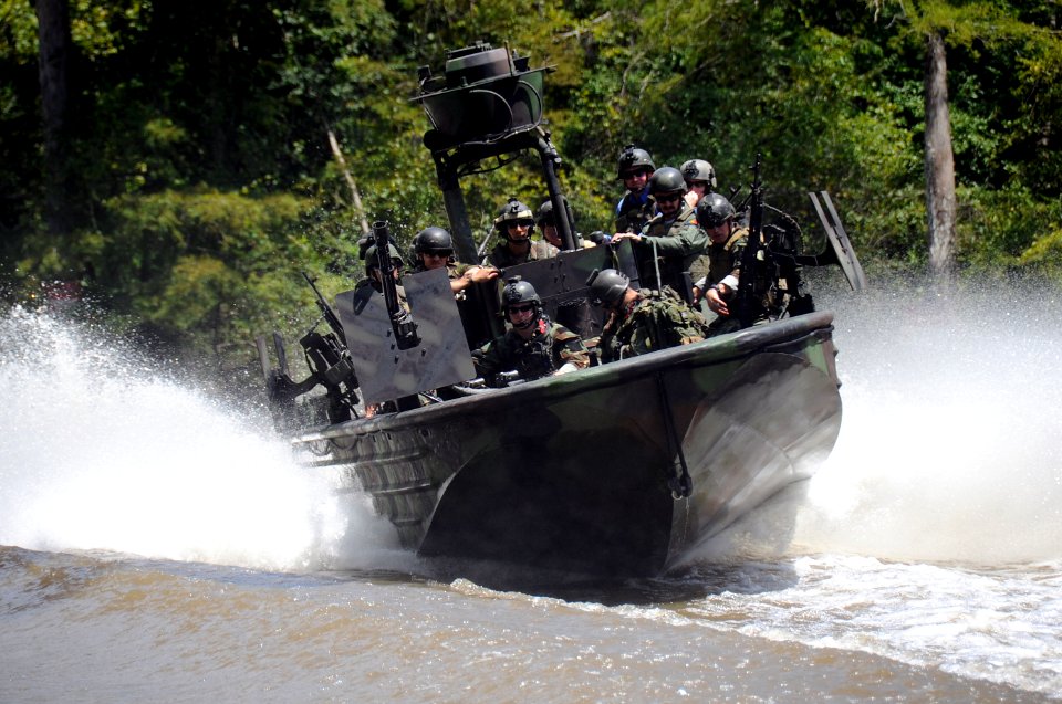 US Navy 090805-N-4205W-142 Romanian Chief of Staff Adm. Gheorge Marin and members of his staff ride in a special operations craft-riverine during a visit to the Naval Small Craft Instruction and Technical Training School