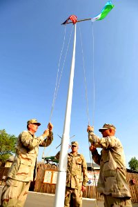 US Navy 090811-N-2420K-003 Chief petty officer selectees raise the American and Djiboutian flags during morning colors at Camp Lemonier
