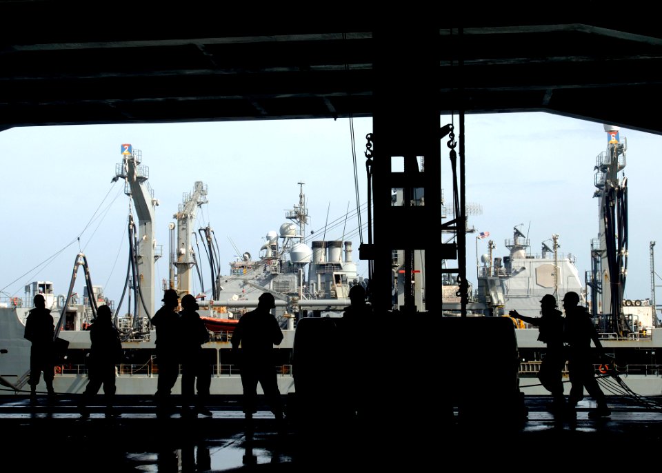 US Navy 090809-N-2013O-087 Sailors assigned to the deck department of the aircraft carrier USS George Washington (CVN 73) receive supplies during a replenishment at sea with the Military Sealift Command fleet replenishment oile