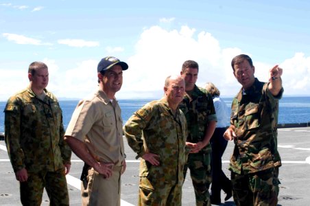 US Navy 090806-N-9689V-003 Capt. John Shaub and Capt. Jonathan Olmsted explain aspects of the ship's flight deck to Australian Defense Force Lt. Gen. Mark Evans during a tour of Richard E. Byrd. Richard E. Byrd