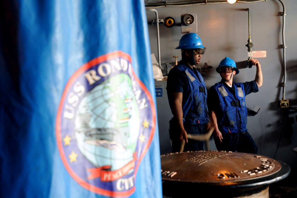 US Navy 090807-N-2344B-099 Boatswain's Mate Seaman Jermia Millsap and Boatswain's Mate Seaman Derick Chandler man a fueling station during a replenishment at sea aboard the aircraft carrier USS Ronald Reagan (CVN 76)