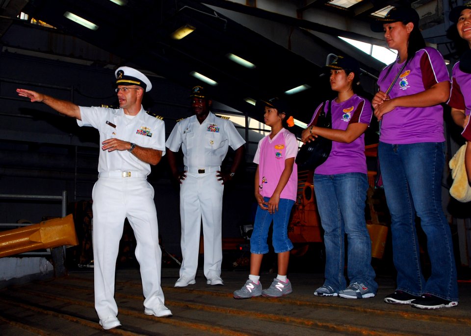 US Navy 090809-N-5207L-044 Lt. Cmdr. David Neal, executive officer of the dock landing ship USS Harpers Ferry (LSD 49), and Commodore Richard L. Clemmons Jr., commander, Destroyer Squadron 31, explain the operation of Harpers F