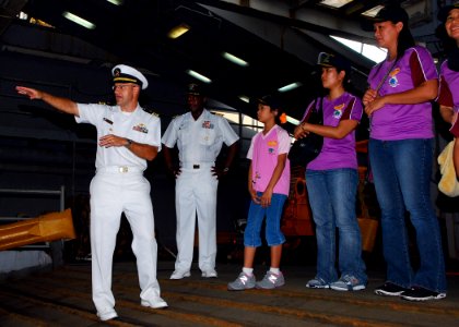 US Navy 090809-N-5207L-044 Lt. Cmdr. David Neal, executive officer of the dock landing ship USS Harpers Ferry (LSD 49), and Commodore Richard L. Clemmons Jr., commander, Destroyer Squadron 31, explain the operation of Harpers F photo