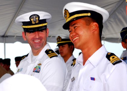 US Navy 090810-N-5207L-007 Lt. Cmdr. Greg Adams assigned to Commander, Task Group 73.5, speaks with a Royal Brunei Navy officer photo
