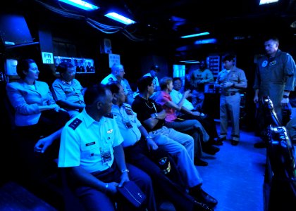 US Navy 090810-N-6233H-148 Rear Adm. Kevin Donegan, commander of Battle Force 7th Fleet, speaks with Republic of the Philippines government officials during a visit aboard the aircraft carrier USS George Washington (CVN 73)