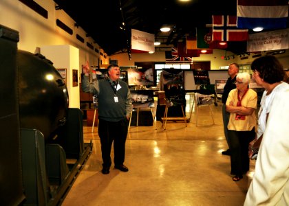 US Navy 090806-N-9671T-043 Dr. David Winkler leads a tour of the Cold War Gallery to a group of teachers