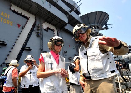 US Navy 090810-N-6233H-025 Capt. Daniel C. Grieco, executive officer of the aircraft carrier USS George Washington (CVN 73), explains flight operations to U.S. Ambassador to the Republic of the Philippines Kristie Kenney on the