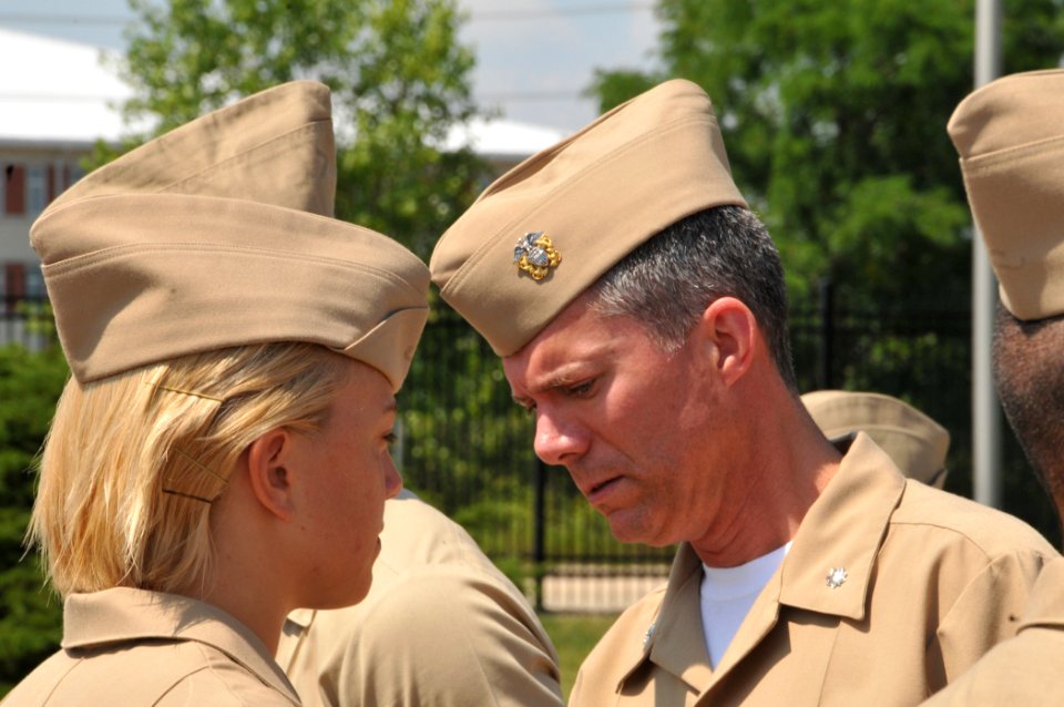 US Navy 090812-N-8848T-049 Cmdr. Donald Lesh, executive officer of the Chicago Naval ROTC Consortium, inspects an incoming freshman at Naval Station Great Lakes, Ill