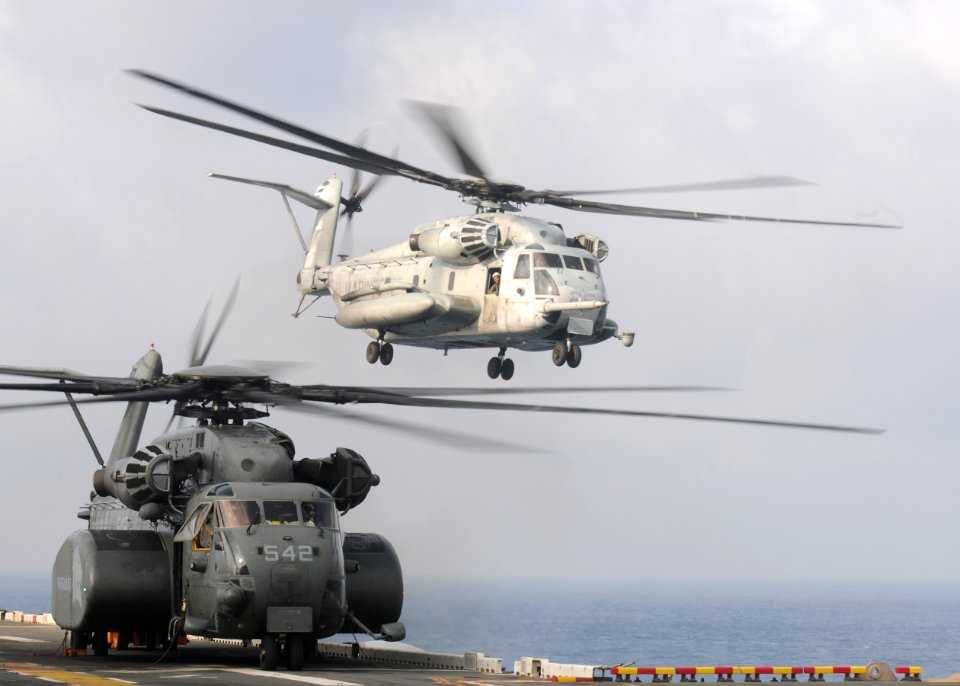 US Navy 090812-N-0120A-072 A CH-53E Sea Stallion helicopter assigned to Marine Medium Helicopter Squadron (HMM) 262 takes off from the forward-deployed amphibious assault ship USS Essex (LHD 2)