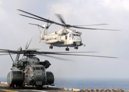 US Navy 090812-N-0120A-072 A CH-53E Sea Stallion helicopter assigned to Marine Medium Helicopter Squadron (HMM) 262 takes off from the forward-deployed amphibious assault ship USS Essex (LHD 2)