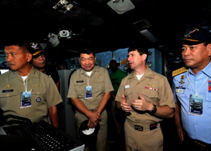 US Navy 090810-N-6233H-123 Rear Adm. Kevin Donegan, center right, commander of Battle Force 7th Fleet, speaks with Vice Adm. Golez, Vice Adm. Marayag and Adm. Tamayo on the navigation bridge during a visit aboard the aircraft c