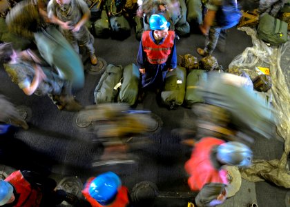 US Navy 090813-N-9950J-131 Lance Cpl. Ryan Parrishsupervises as Marines assigned to the 31st Marine Expeditionary Unit debark Essex after exercise Talisman Saber
