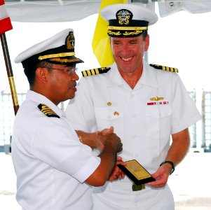 US Navy 090810-N-5207L-059 Royal Brunei Navy Lt. Col. Spry bin Haji Seruji presents Capt. William Kearns III, commander of Task Group 73.5