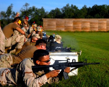 US Navy 090810-N-9564W-032 Equipment Operator 3rd Class Jonathan Rust, assigned to Naval Mobile Construction Battalion (NMCB) 74, Alfa Company photo