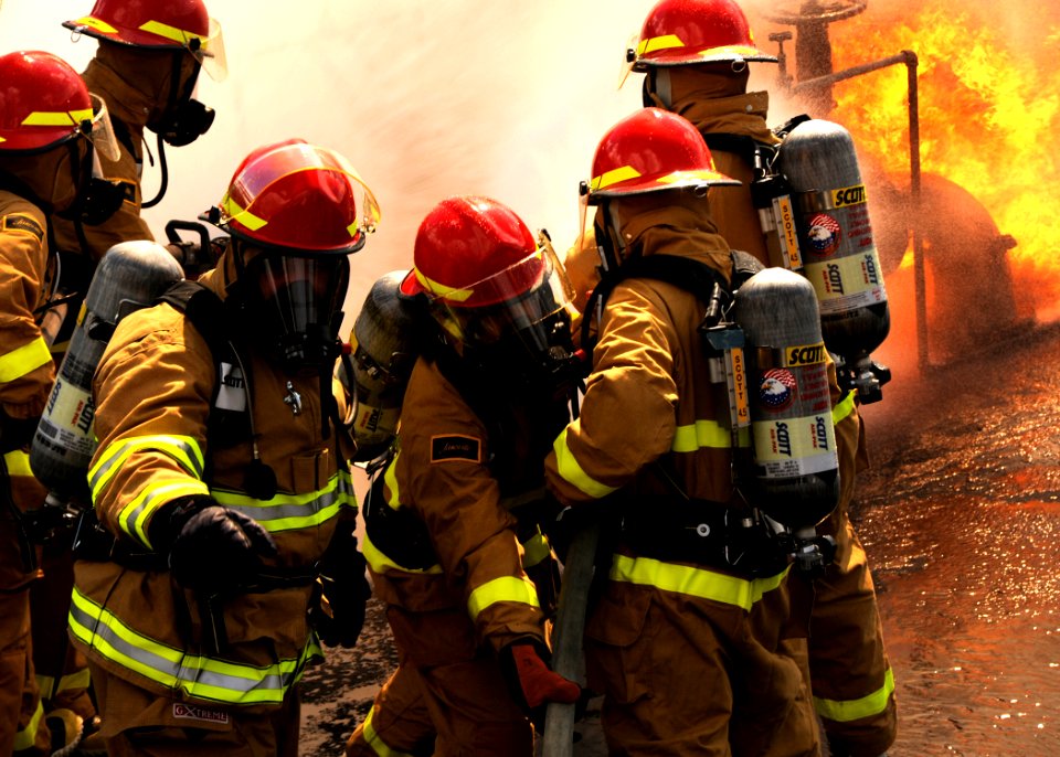 US Navy 090811-N-2147L-002 Members of the dock landing ship Pre-Commissioning Unit (PCU) New York (LPD 21) repair division practice fighting fires at the Jefferson Parish Fire Training Center