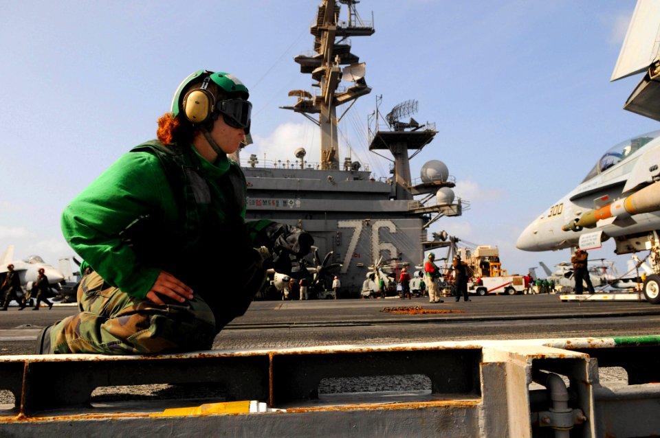 US Navy 090814-N-3610L-078 Aviation Boatswain's Mate (Equipment) Airman Susan Rodriguezrivera awaits flight operations aboard the aircraft carrier USS Ronald Reagan (CVN 76). Ronald Reagan is deployed to the U.S. 5th Fleet area