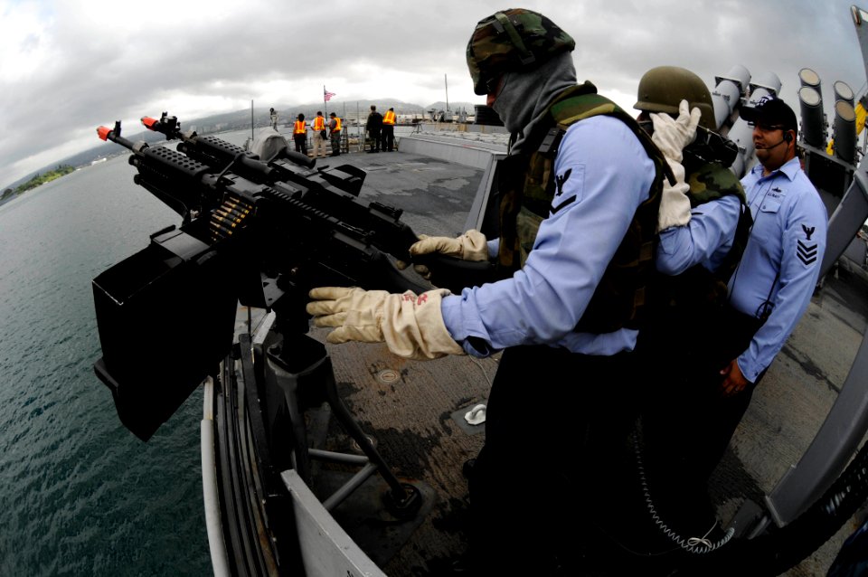 US Navy 090812-N-7498L-119 Gunner's Mate 3rd Class Justin Varner, from Camby, Texas, prepares an M-240 machine gun aboard the guided-missile destroyer USS O'Kane (DDG 77) as the ship prepares to defend from small boat attacks