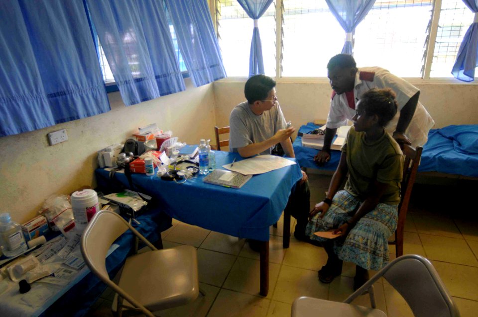 US Navy 090811-N-9689V-002 Republic of Korea Navy Cmdr. Don Kee Yu, a dermatologist, embarked aboard the Military Sealift Command dry cargo-ammunition ship USNS Richard E. Byrd (T-AKE 4) consults with patients