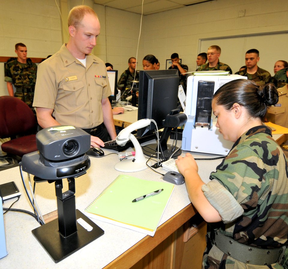 US Navy 090813-N-8848T-106 Midshipman 4th Class Nina Johnson, from Chicago, Ill., an incoming freshman at the Illinois Institute of Technology, punches in her social security number for her first military identification card