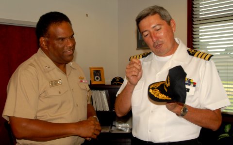 US Navy 090812-N-2821G-007 cuador Navy Capt. Ramon Ruben Orellana Mariscal, right, presents a gift to Rear Adm. Victor G. Guillory photo