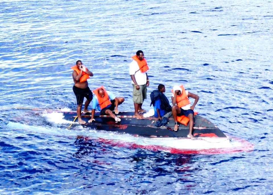 US Navy 090811-N-0000X-016 Five stranded Bahamian nationals were spotted and rescued by crewmembers of the Ohio-class, ballistic-missile submarine USS Rhode Island