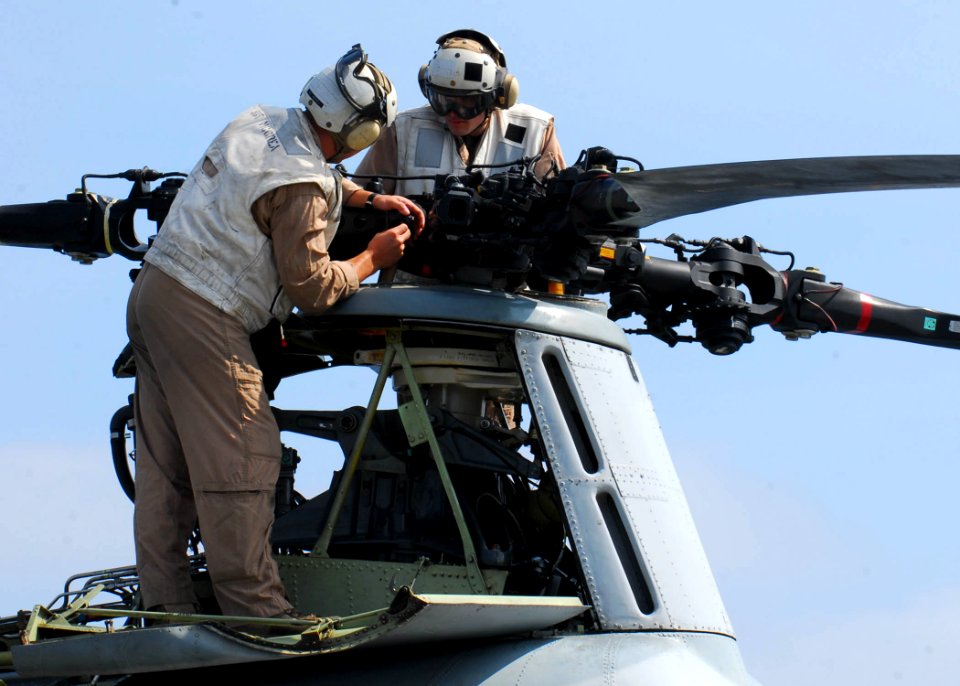 US Navy 090813-N-0515W-021 Marines attached to Marine Medium Helicopter Squadron 166 (Reinforced) perform maintenance on the propellers of a CH-46 Sea Knight